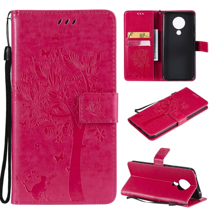 Magenta red leather phone wallet case with tree and butterfly pattern, flip cover, card slots