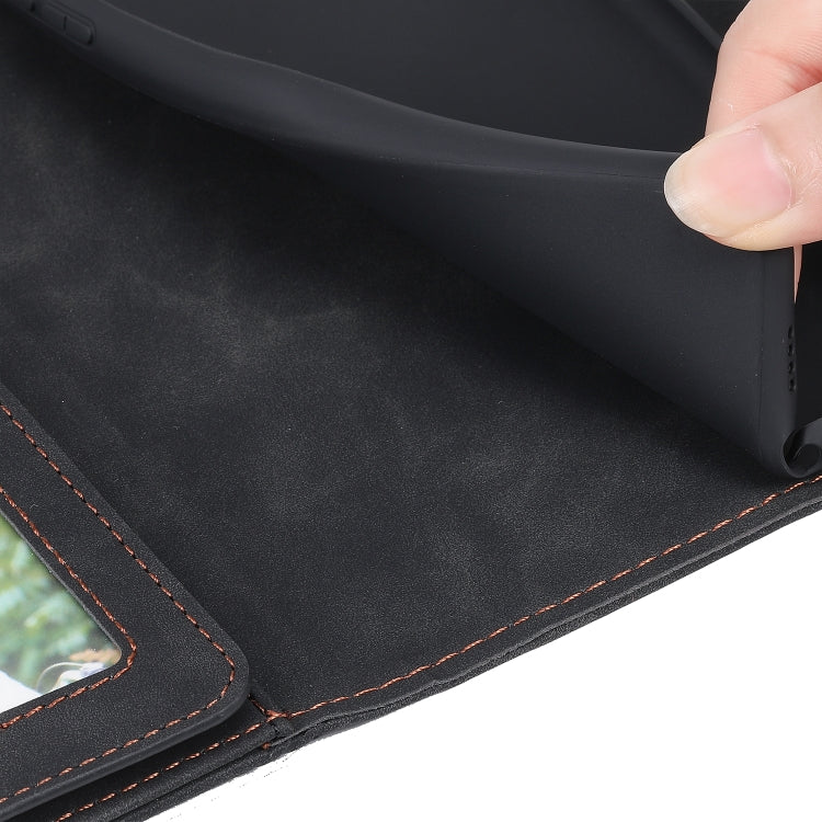 Close-up of black PU leather phone case with orange-stitched edge and corner trim