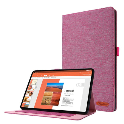 Pink fabric-texture flip case with stand; tablet held upright
