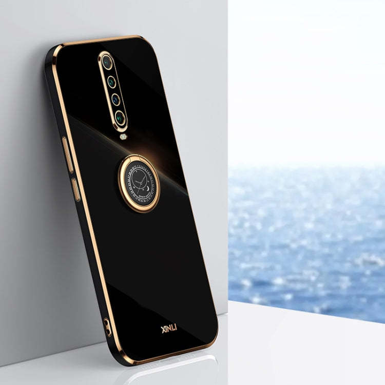 Black TPU phone case with gold-edged ring holder and camera cutouts
