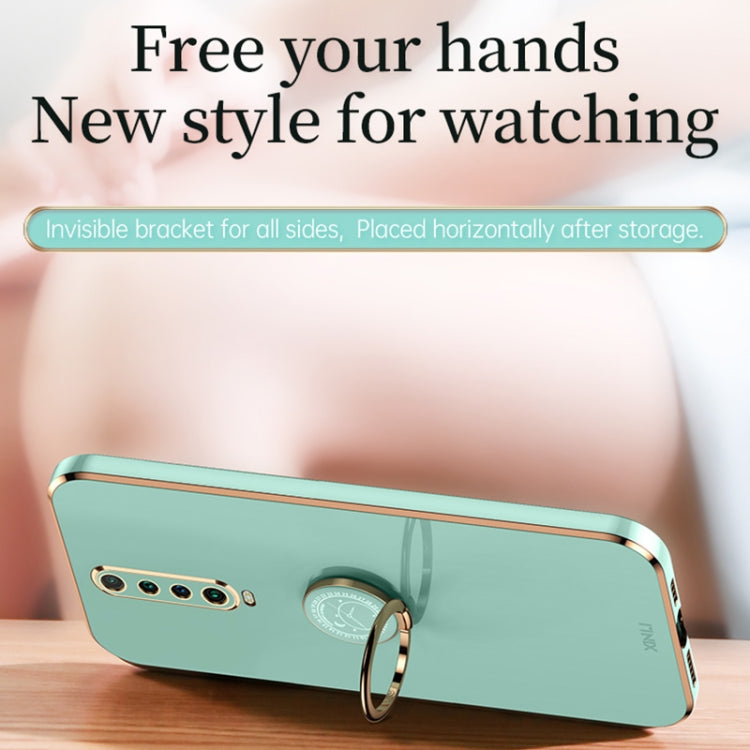 Mint green TPU phone case with gold ring holder and side camera openings