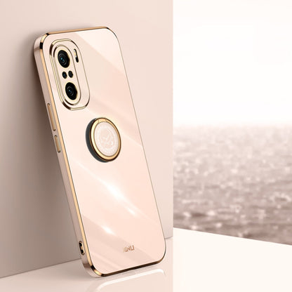 Beige TPU phone case with ring holder and gold-toned trim; visible camera cutouts