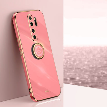 Pink electroplate TPU phone case with ring holder, gold-edged camera cutout.