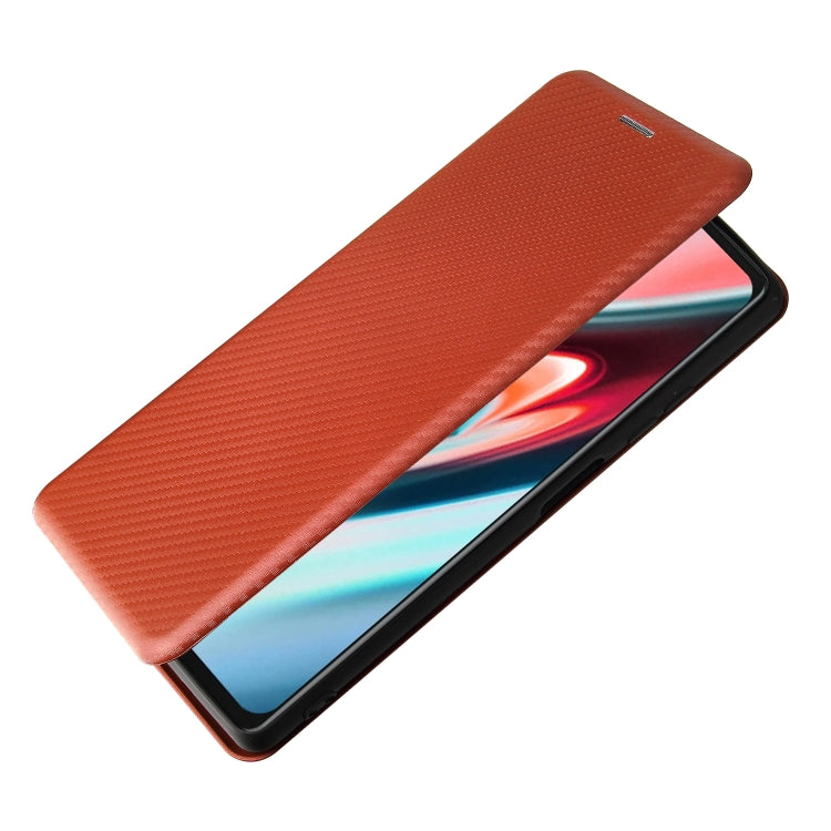 Brown carbon-fiber textured magnetic flip phone case covering the phone display