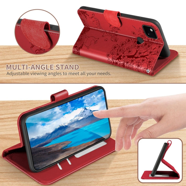 Red embossed folio phone case folded as a stand with phone supported in landscape