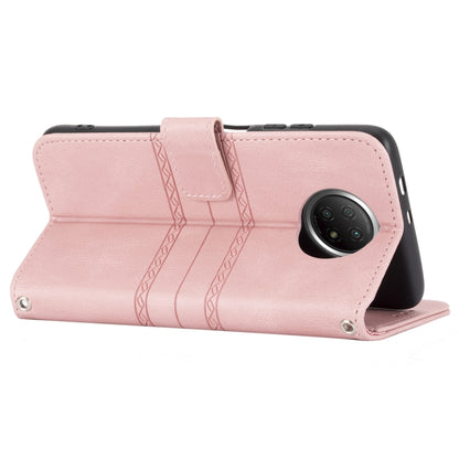 Pink horizontal flip wallet case with camera cutout, strap tab, and embossed stripes