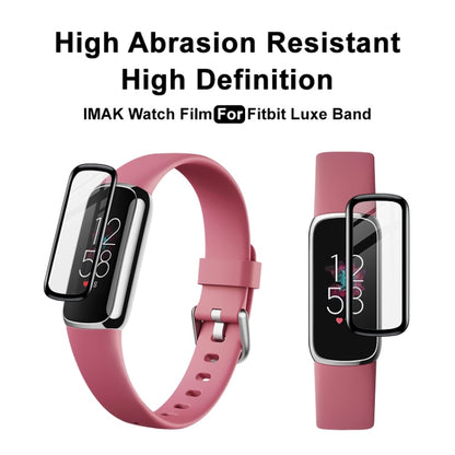 Installed clear watch screen film shown on pink fitness tracker bands.