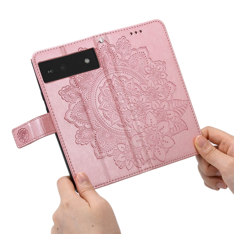 Rose gold PU leather wallet phone case with embossed mandala floral pattern and wrist strap