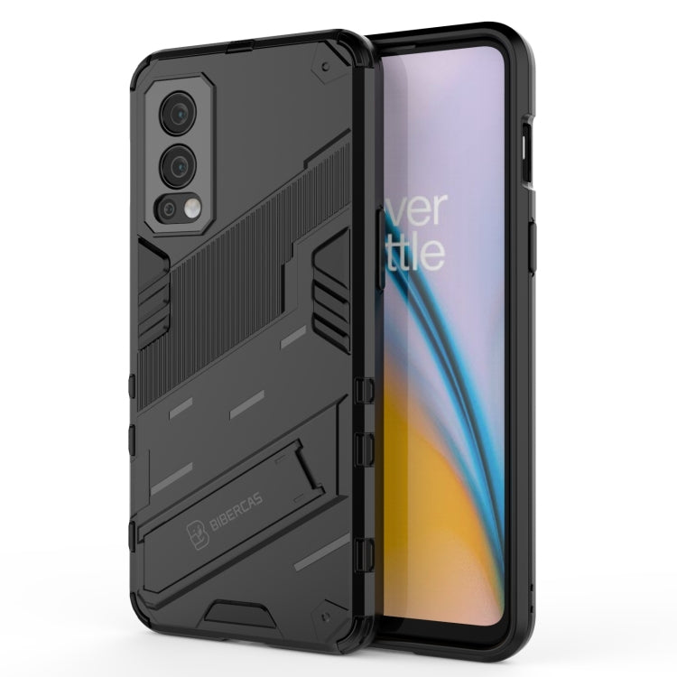 Black shockproof phone case with kickstand and raised camera guard; TPU shell.