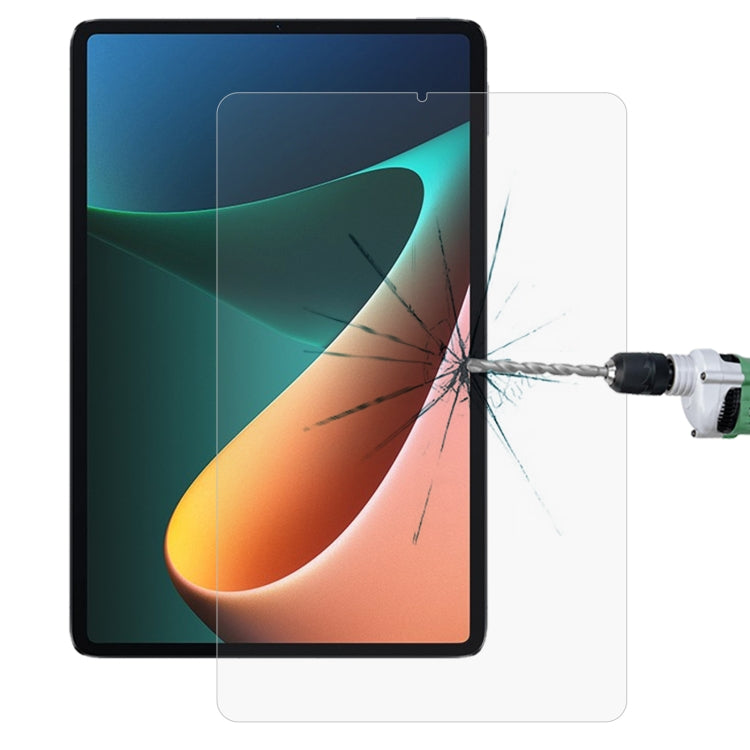 Tempered glass screen protector for tablet, showing spiderweb crack from impact test