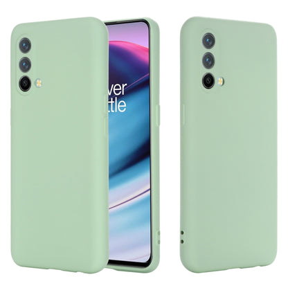 Green silicone phone case, shockproof full-coverage back with camera cutouts.