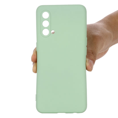 Green silicone phone case back with camera and flash openings.