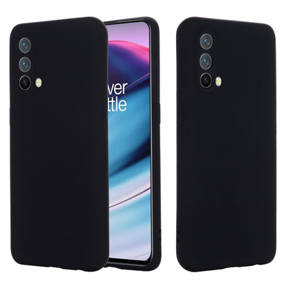 Black silicone phone case, shockproof full-coverage back with camera cutouts.