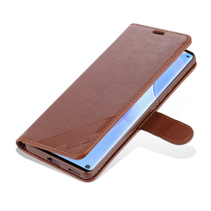 Brown flip leather wallet case with side strap; phone screen shows through front opening