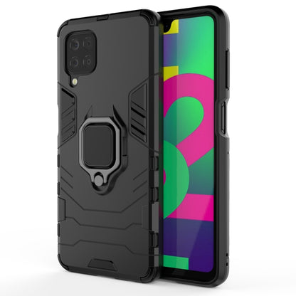 Black shockproof phone case with magnetic ring holder and raised camera protection