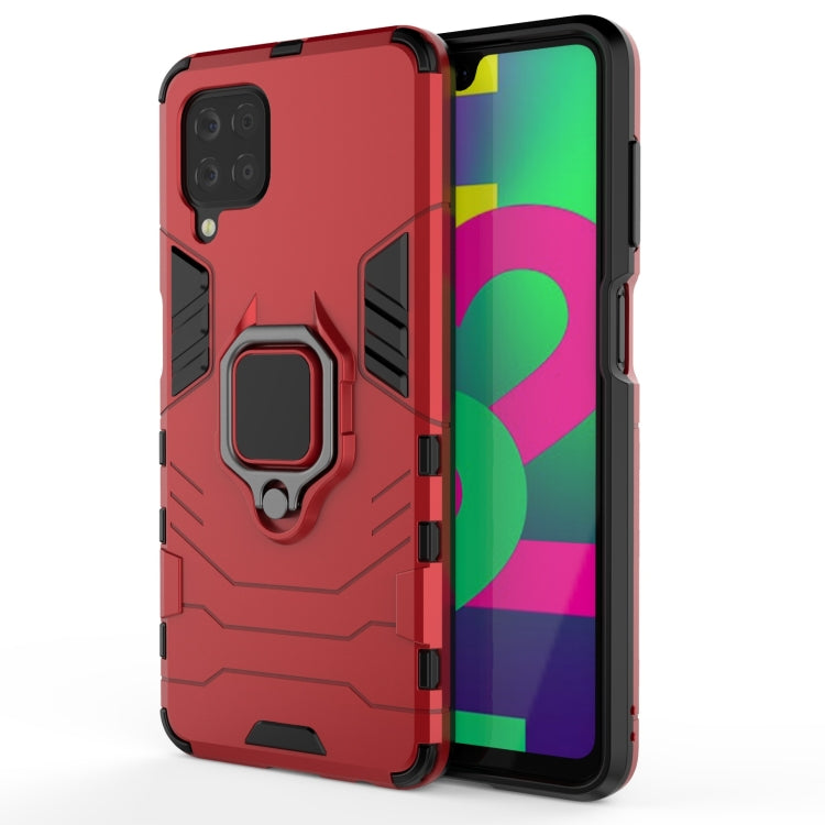 Red shockproof phone case with magnetic ring holder, protective corners and camera cutout