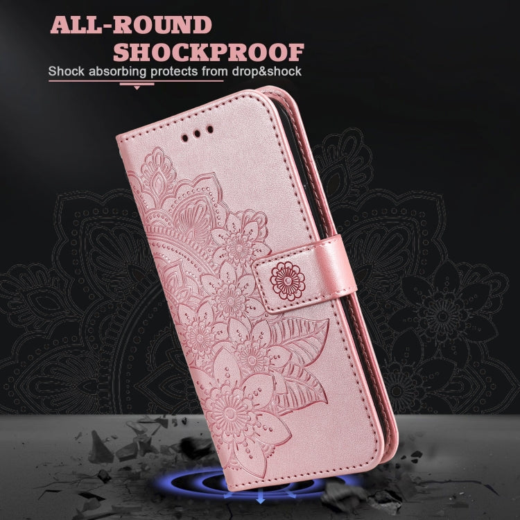 Rose pink PU leather flip phone case with embossed 7-petal floral pattern and side strap