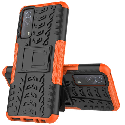 Orange and black shockproof phone case with textured grip and built-in holder