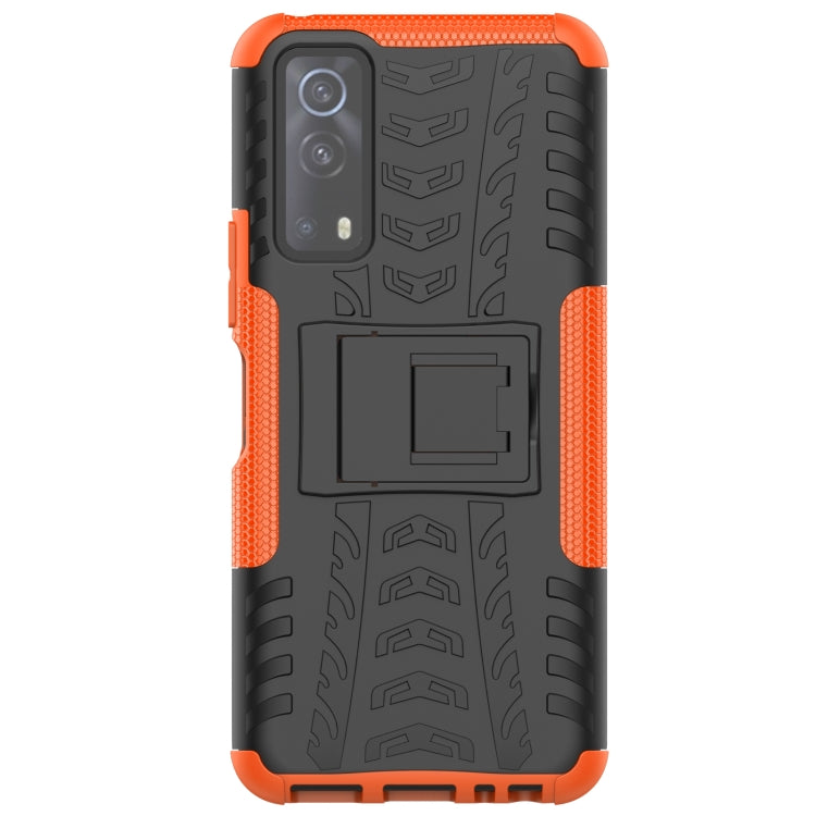 Orange-edged black rugged phone case with textured surface and holder panel