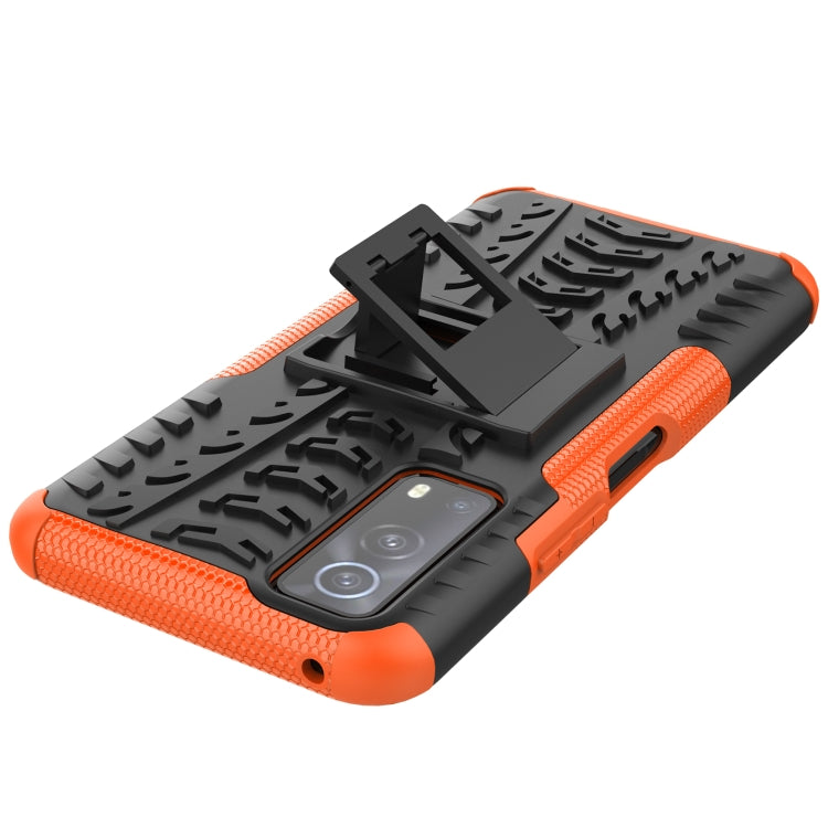 Rugged black and orange phone case with textured grip and raised camera protection