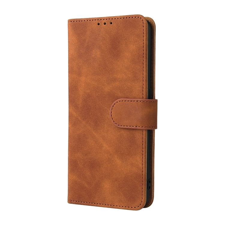 Brown PU leather flip phone case with magnetic strap and stitched textured front