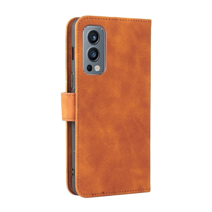 Brown PU leather flip phone wallet case with camera cutout and side hand strap.
