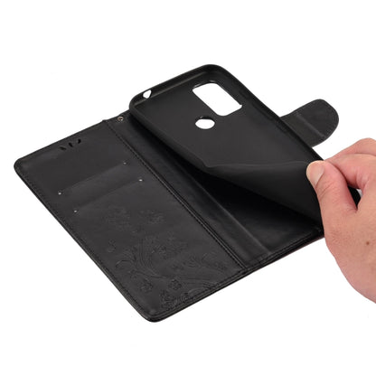 Black leather flip phone case with embossed floral pattern and card slot compartments