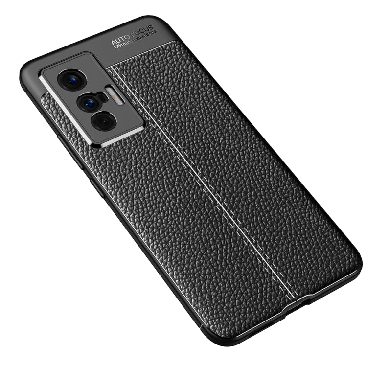 Black textured TPU phone case with diagonal seam detail and triple-camera cutout