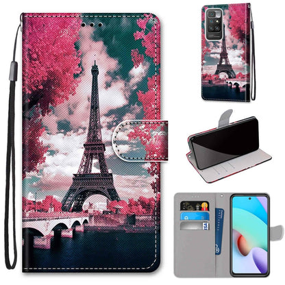 Phone wallet case with flip cover, card slots, and wrist strap; pink Eiffel Tower scene.