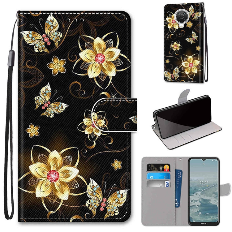 Phone wallet case with flip cover, card slots, and lanyard; black with gold floral butterfly print.