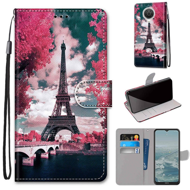 Phone wallet case with flip cover, card slots, and lanyard; Eiffel Tower scene print on PU.