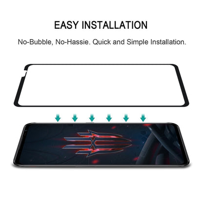 Tempered glass screen protector installation guide with applied screen on dark phone