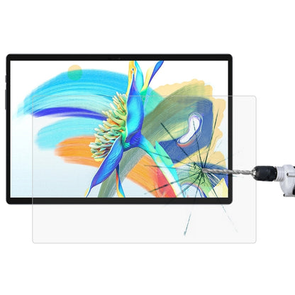 Tablet with clear tempered glass screen protector protecting display with impact cracks.