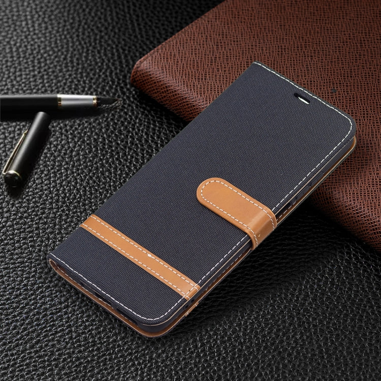 Denim texture wallet phone case with magnetic flap and tan stitched trim; dark blue