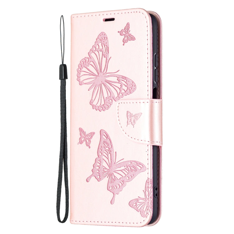Pink leather phone wallet case with butterfly embossing and attached wrist lanyard.