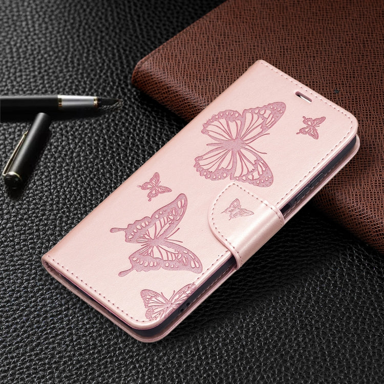 Pink leather phone case with butterfly embossing; slim flip wallet design.