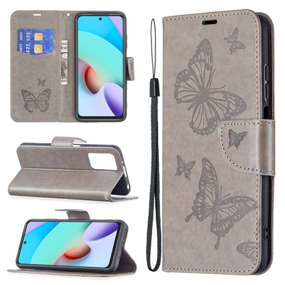 Gray leather flip phone wallet case with butterfly embossing, card slot, and lanyard.