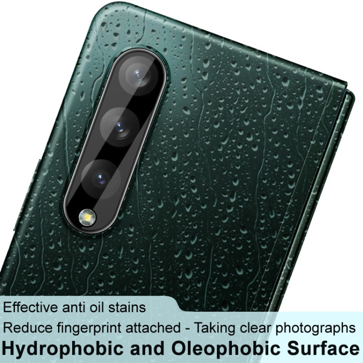 Close-up: black integrated rear camera lens glass film and lens cap on phone