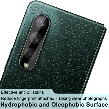 Close-up: black integrated rear camera lens glass film and lens cap on phone