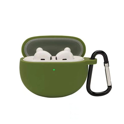 Grass green silicone earbud case with hook, holding two white earbuds in a lid-open shell