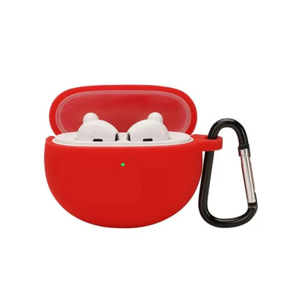 Red silicone earbud case with hook, holding two white earbuds in a lid-open shell