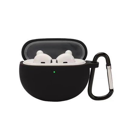Black silicone earbud case with hook, holding two white earbuds in a lid-open shell