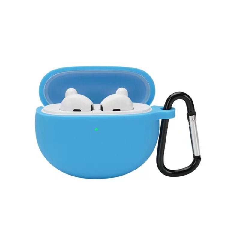 Sky blue silicone earbud case with hook, holding two white earbuds in a lid-open shell