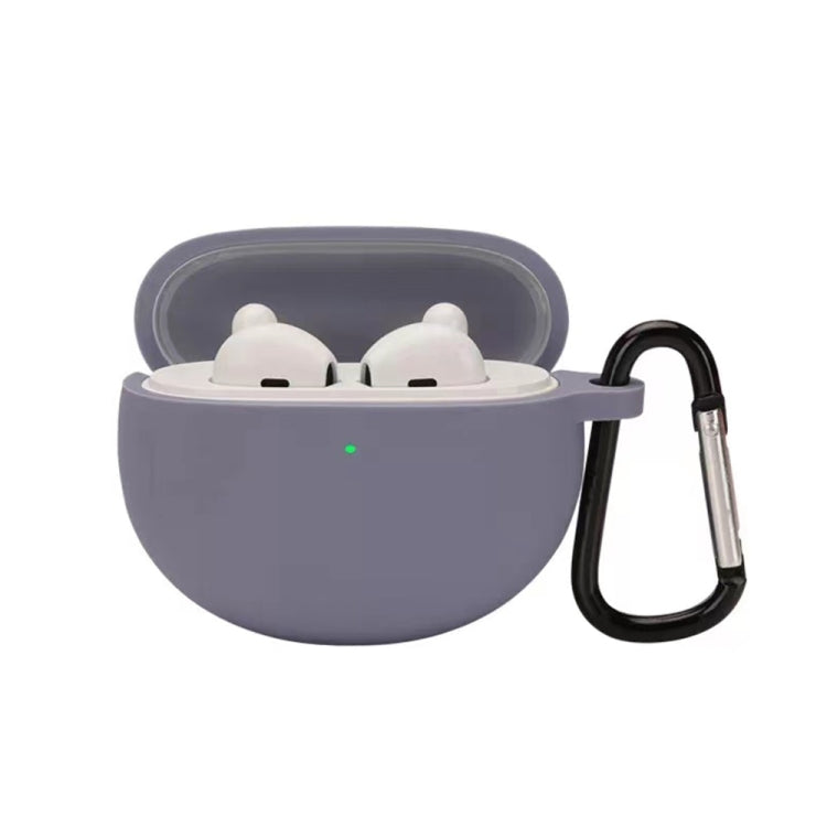Lavender silicone earbud case with hook, holding two white earbuds in a lid-open shell