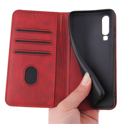 Red leather wallet flip case open, showing card slots and holding the phone