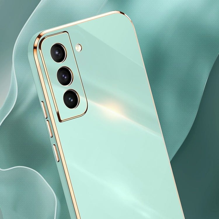 Mint green electroplate TPU phone case with gold trim and triple camera cutouts