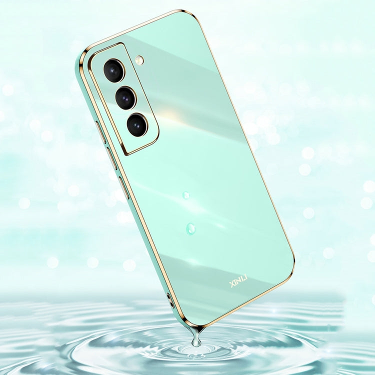 Mint green electroplate TPU phone case with gold trim and triple camera cutouts
