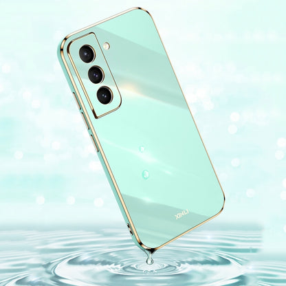 Mint green electroplate TPU phone case with gold trim and triple camera cutouts