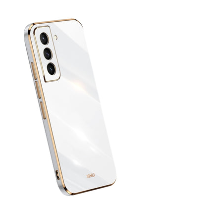 White electroplate TPU phone case with gold trim and triple camera cutouts