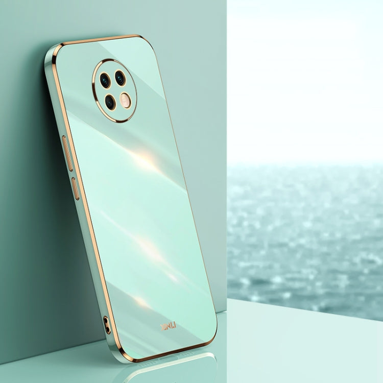 Mint green electroplate TPU phone case with gold trim and camera cutouts